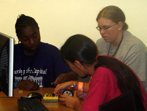 CS campers work as a team when constructing their lego robots. 