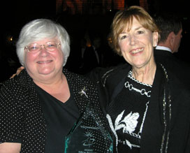 Jean Jackson congratulates 2005 MIRA Bridge Builder Award winner, Fran McCollum (left). 