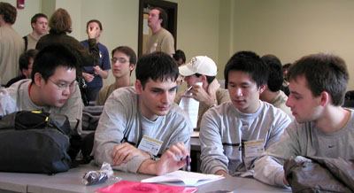 Ferry Unardi, Emil Stefanov, Hong Chen and Tomek review the problems after the ACM contest. 
