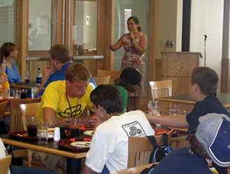 Stephanie Herman of Raytheon speaks to a group of CS middle-school campers. 