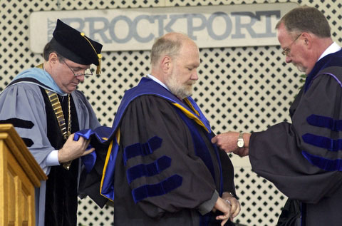 Professor Spafford receiving his hood for his honorary doctorate. 