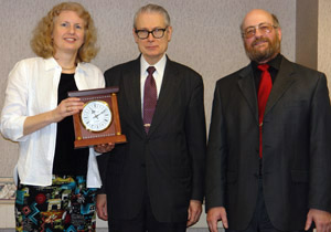 Prof. Susanne Hambrusch and Bob Stwalley (right) congratulate Dr. Gorman.