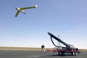 A pneumatic wedge catapult launches the Scan Eagle. 