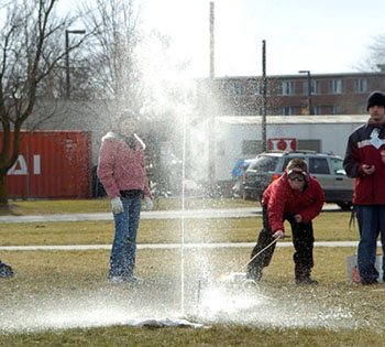Students launch a bottle rocket at the 2005 Science Olympiad. 