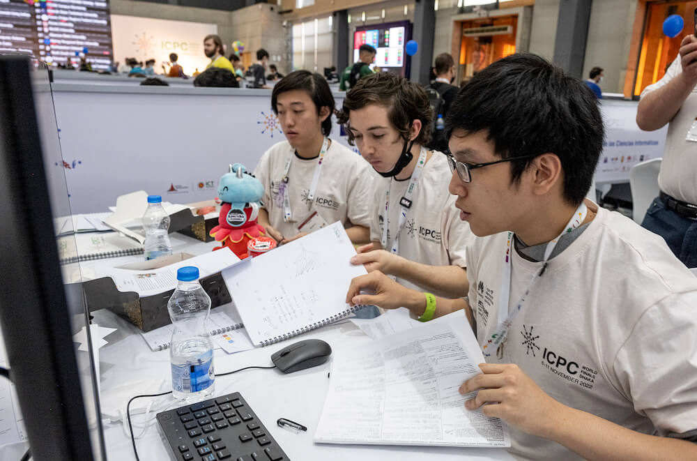 Richard Li, Riley Borgard, and Trung Dang solve algorithmic programming problems at the ICPC World Final, 2021