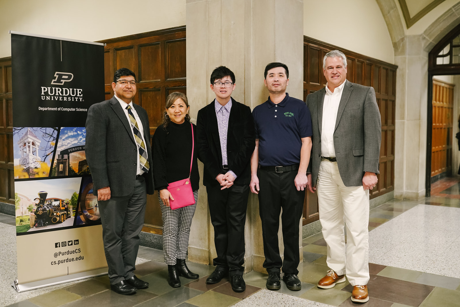 Ryan Cheng and his family, Professor Sunil Prabhakar, and Assistant Department Head Randy Bond