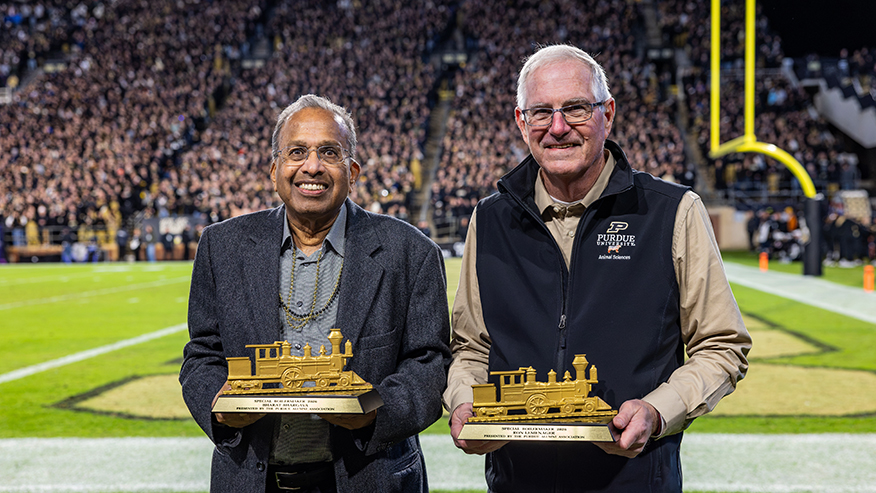 Bharat Bhargava, left, and Ron Lemenager were recognized as recipients of the Purdue Alumni Association’s 2026 Special Boilermaker Award at a home football game Oct. 16. (Photo provided)