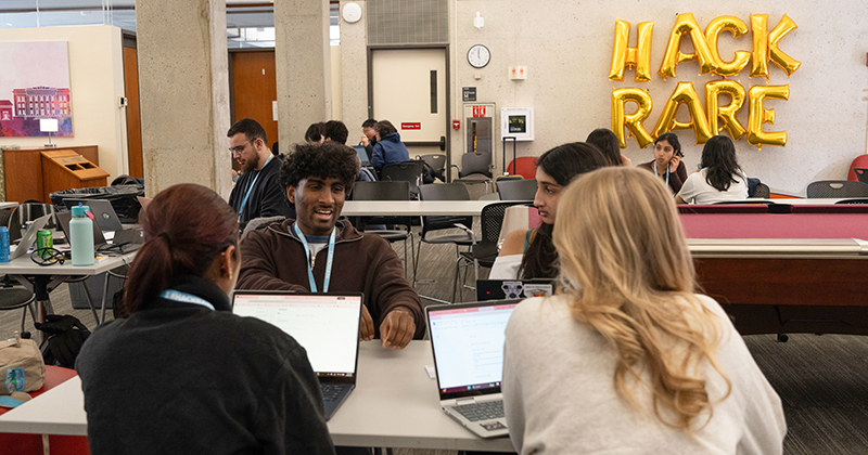 Kezia Samuel and EmmiLee Whittington work with their group for the HackRare competition.(Photo provided by Harvard Undergraduate Rare Diseases)