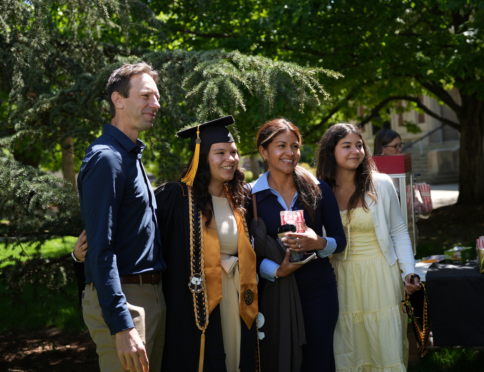 A college of Science Graduate poses with her family