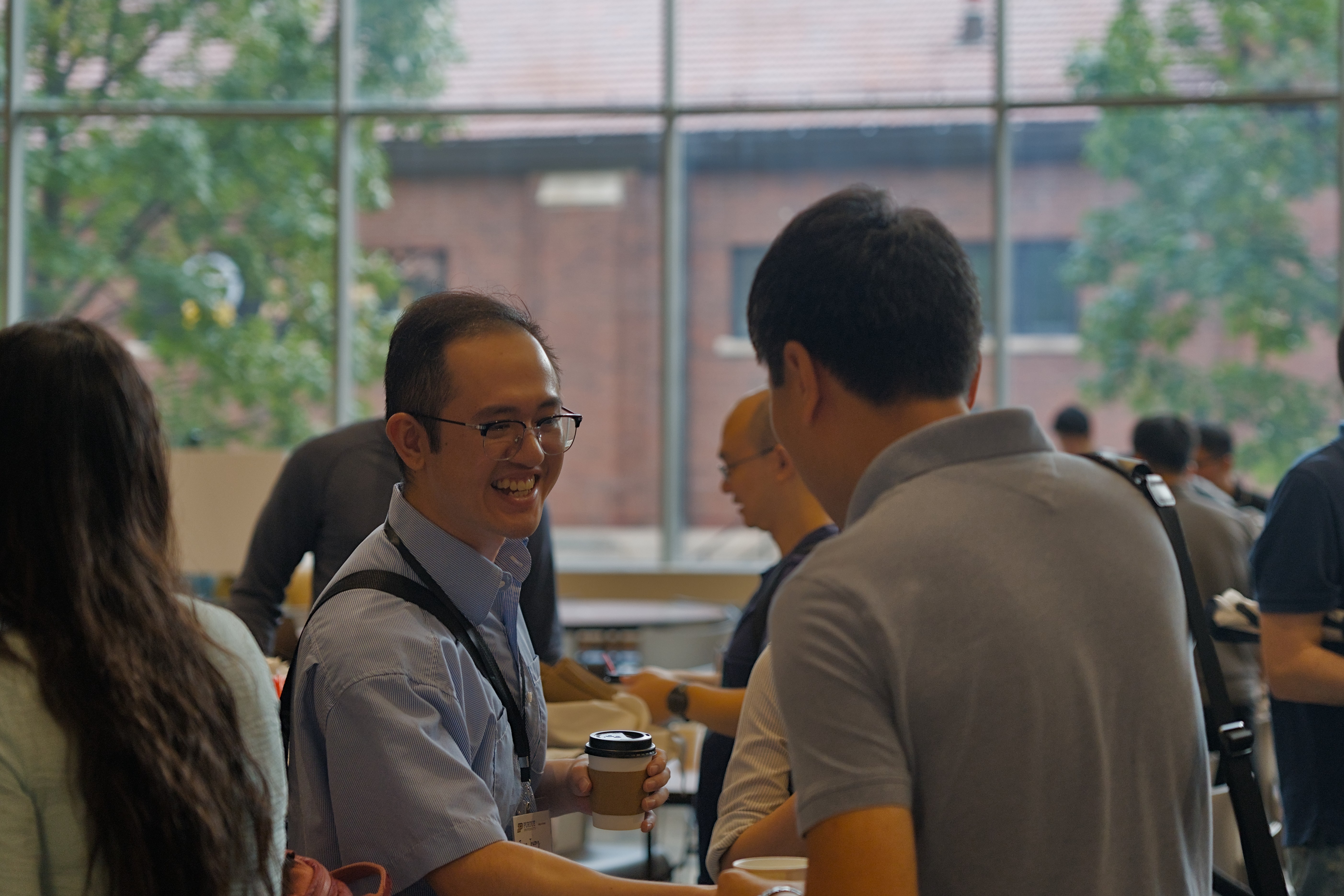 Interacting people at GLSIAM conference.