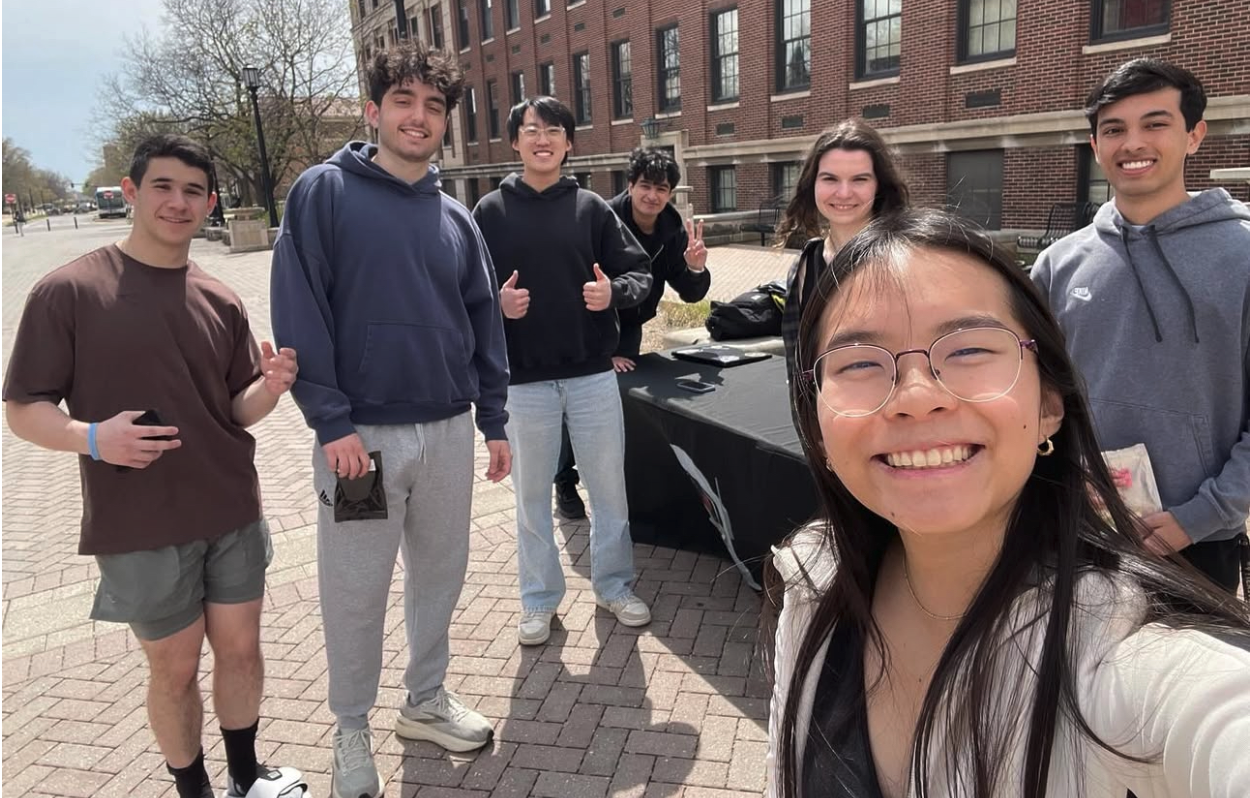 From left to right: Zach O’Connell, Benji Emini, Max Xu, Pranav Kumar, Amber Joneleit, Brianna Yu, and Sean VandenBussche, presenting at one of the team’s outreach events by engaging the community with space trivia, Artemis and NASA SUITS insights, and freeze-dried Skittles | Photo Credit: Brianna Yu